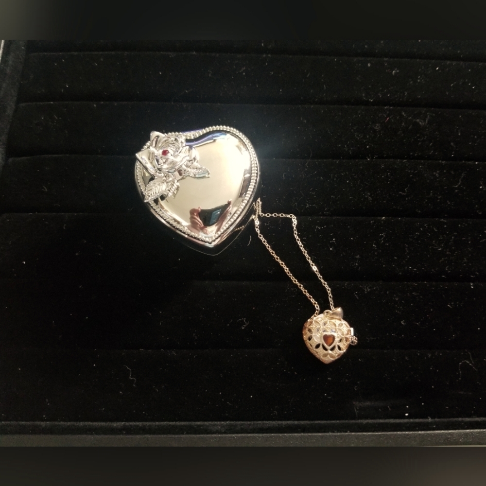 Avon Silver heart container with heart locket necklace